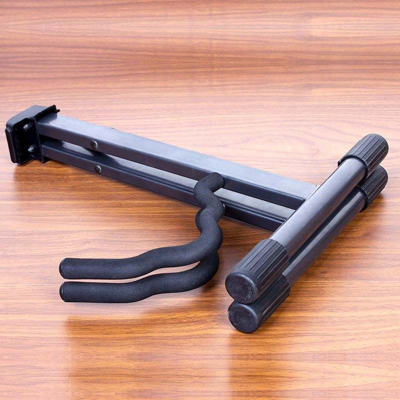 Factory photo: folding guitar stand folded flat for transport