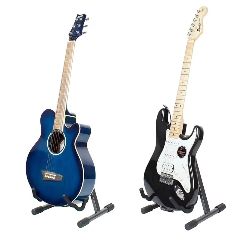 Factory photo: acoustic and electric guitars resting on Yinyu floor guitar stands