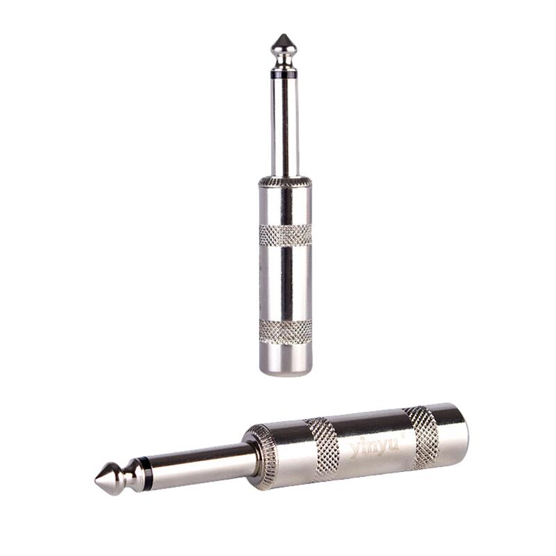 Factory photo of 6.35mm TS plugs with knurled metal bodies, engraved with the Yinyu brand